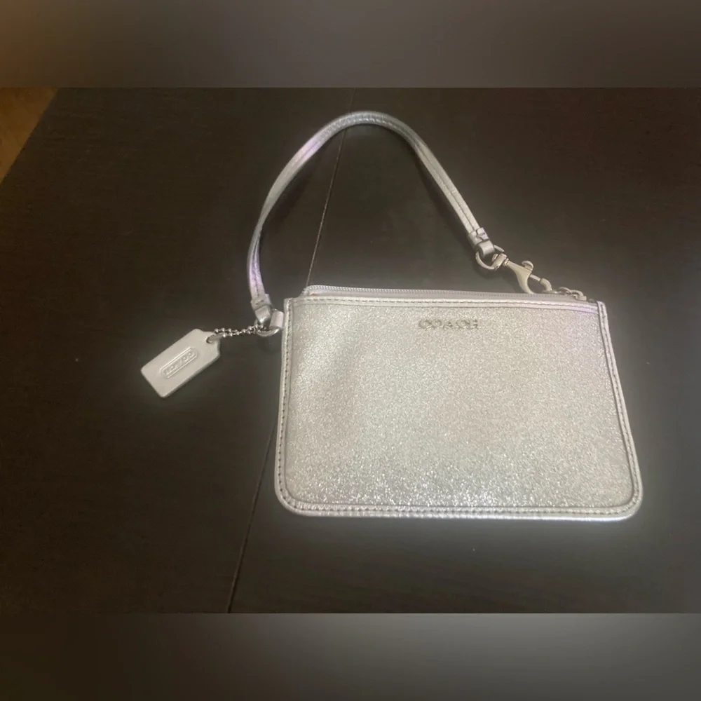 Coach Vintage glittery silver skinny zip wristlet wallet. Good used condition
